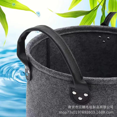 Gray felt basket with black handles for quirky dog toys storage and a clutter-free home