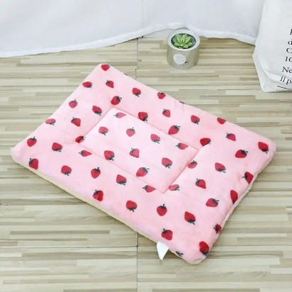 Pink strawberry-patterned pet bed.