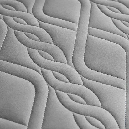 Gray quilted fabric with interwoven pattern.