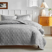 Gray quilted bedding set.