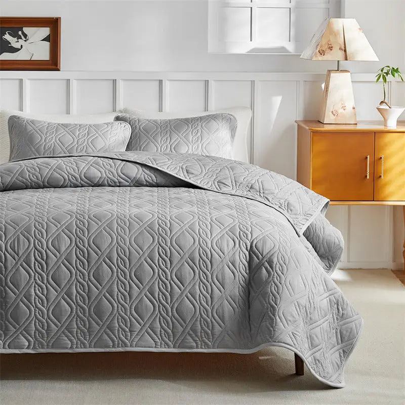 Gray quilted bedding set.