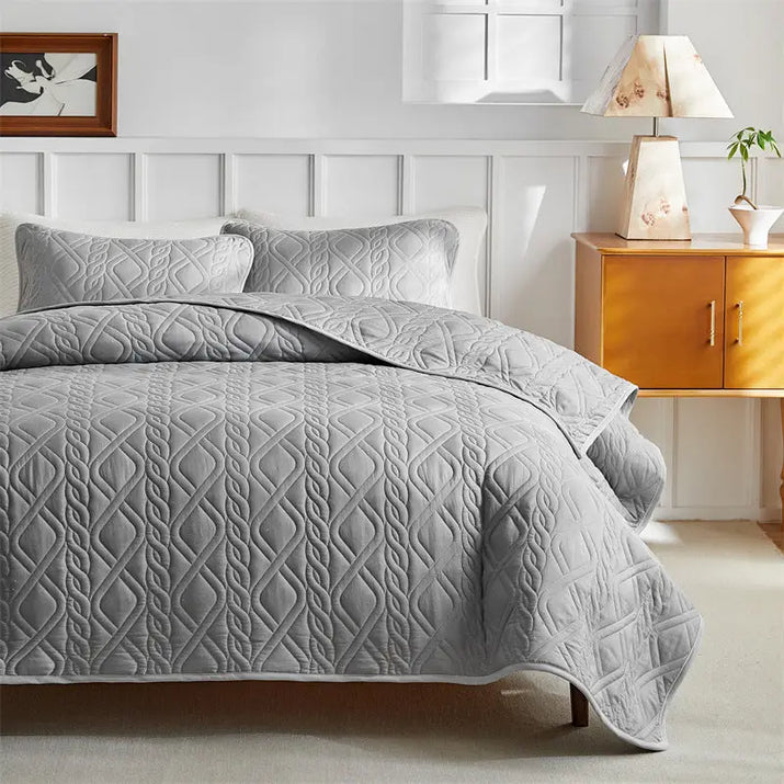 Gray quilted bedding set.