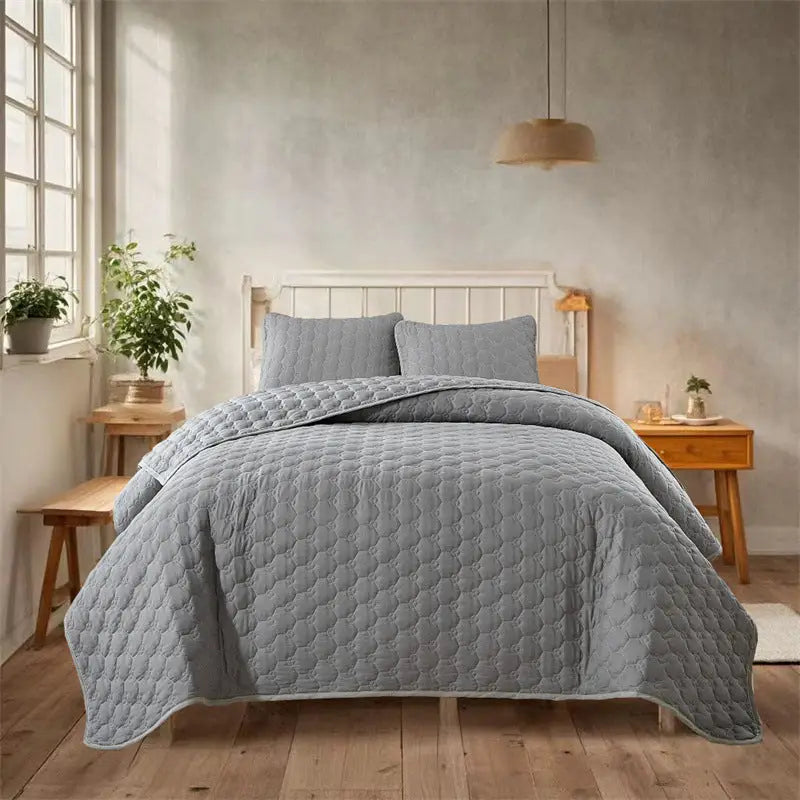 Gray quilted bedding set.