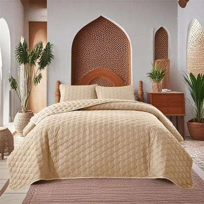 Beige quilted bedspread.
