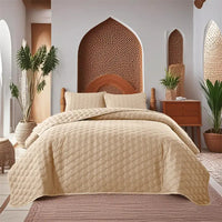 Beige quilted bedspread.