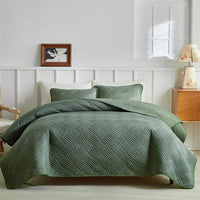 Green quilted bedspread.