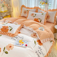 Floral-patterned bedding set with ruffled edges.