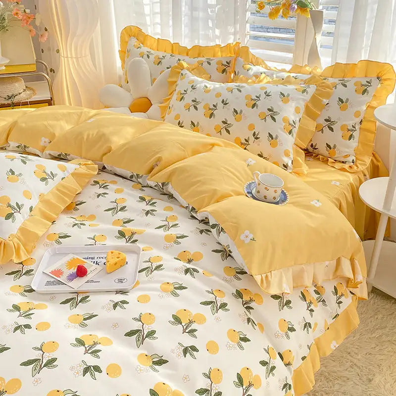 Yellow and white floral bedding set.