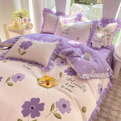 Floral-patterned bedding set with ruffled edges.