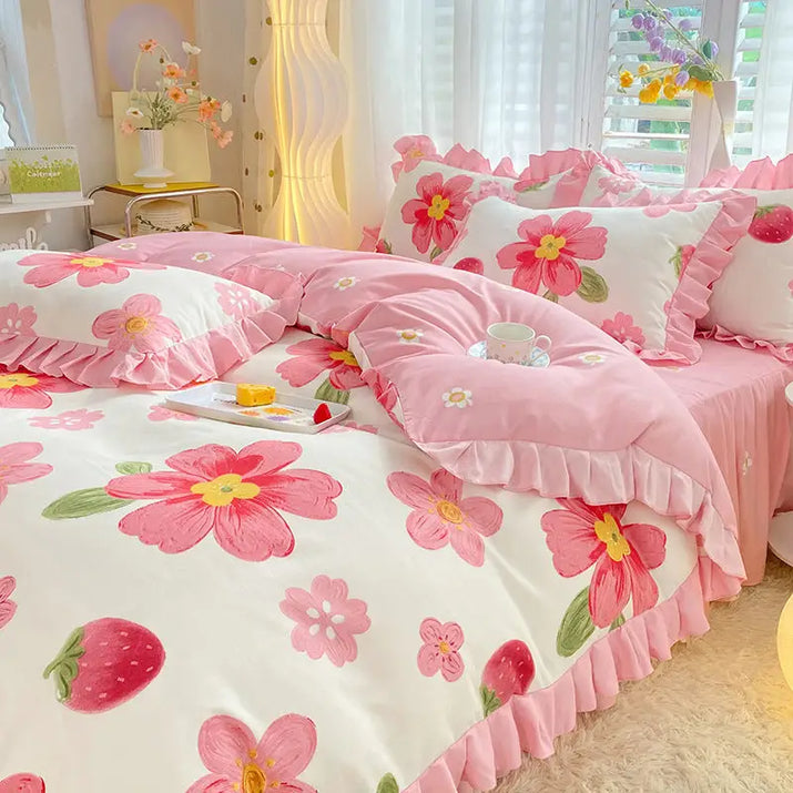 Floral and strawberry patterned bedding.