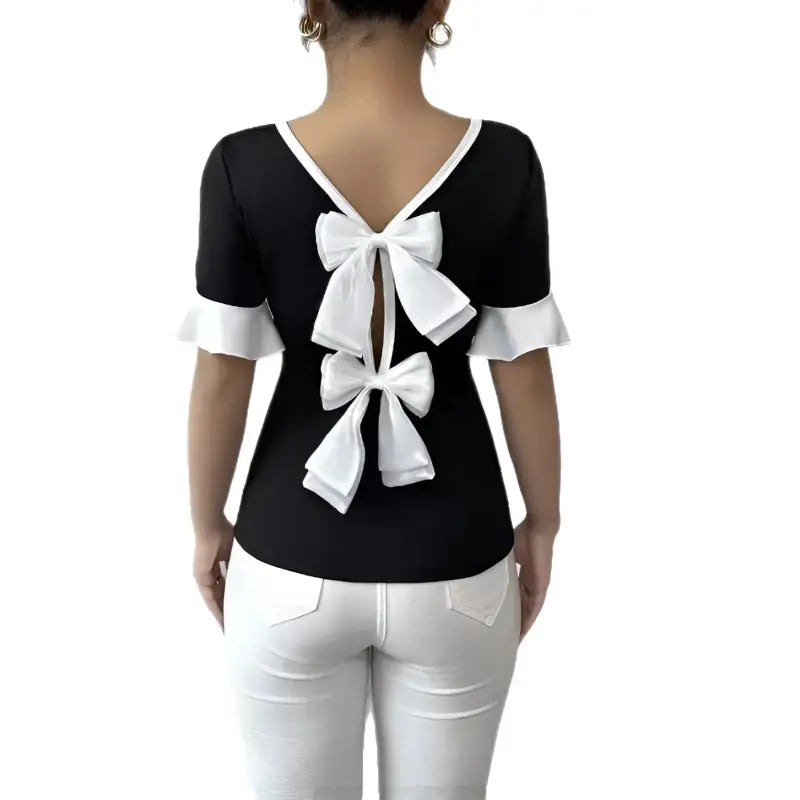 Black and white blouse with back bows.