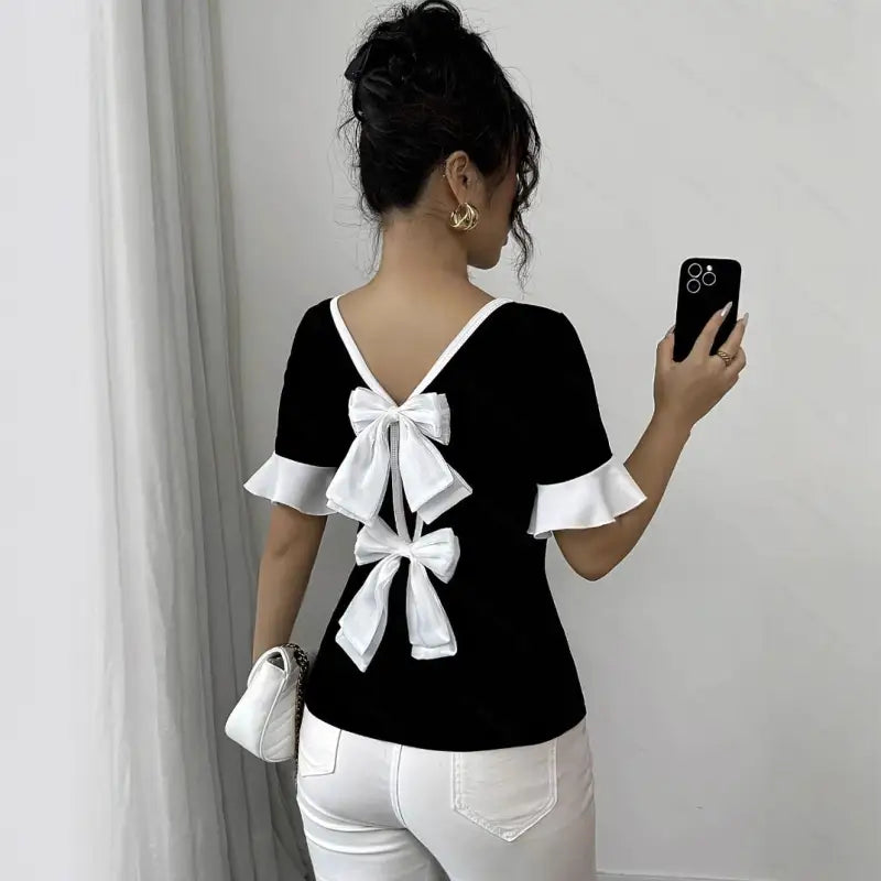 Black top with white bows.