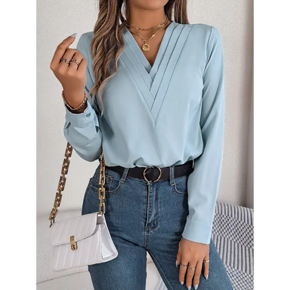 Light blue long-sleeved blouse.