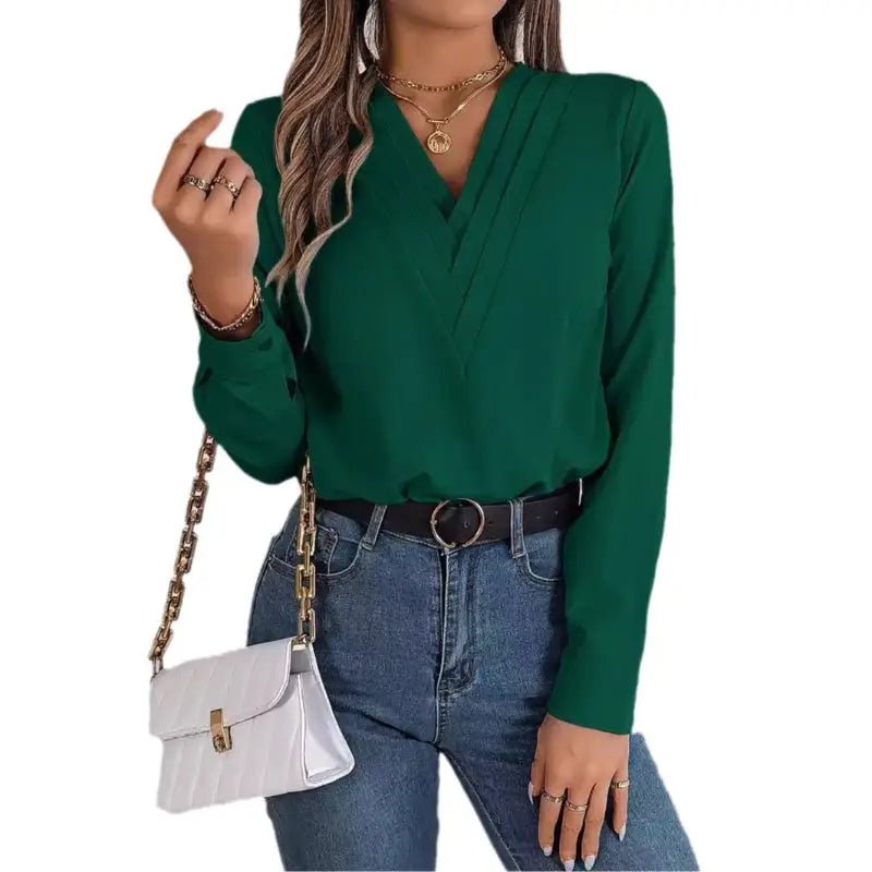 Woman’s green long-sleeved blouse.