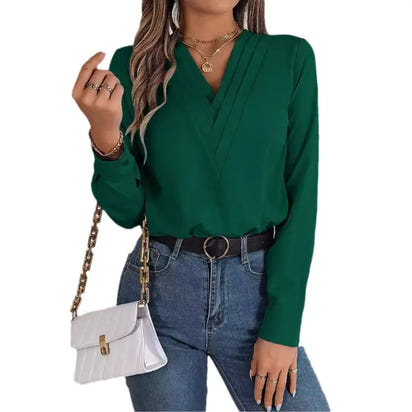 Woman’s green long-sleeved blouse.