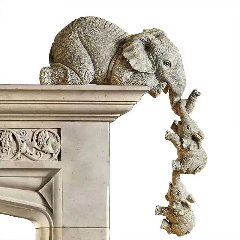 Elephant statue with hanging baby elephants.