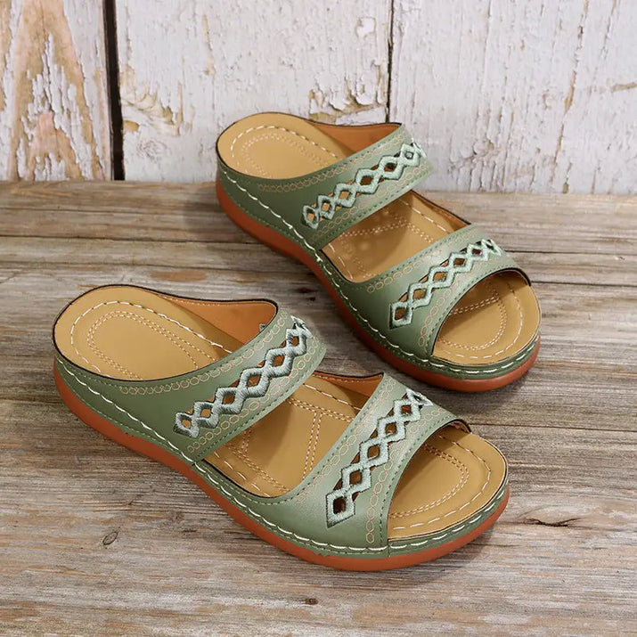 Green two-strap sandals.