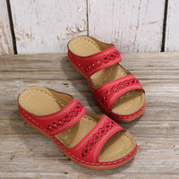 Red, open-toe, platform sandals.
