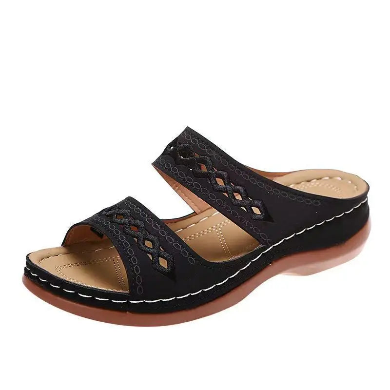 Black, two-strap wedge sandal.