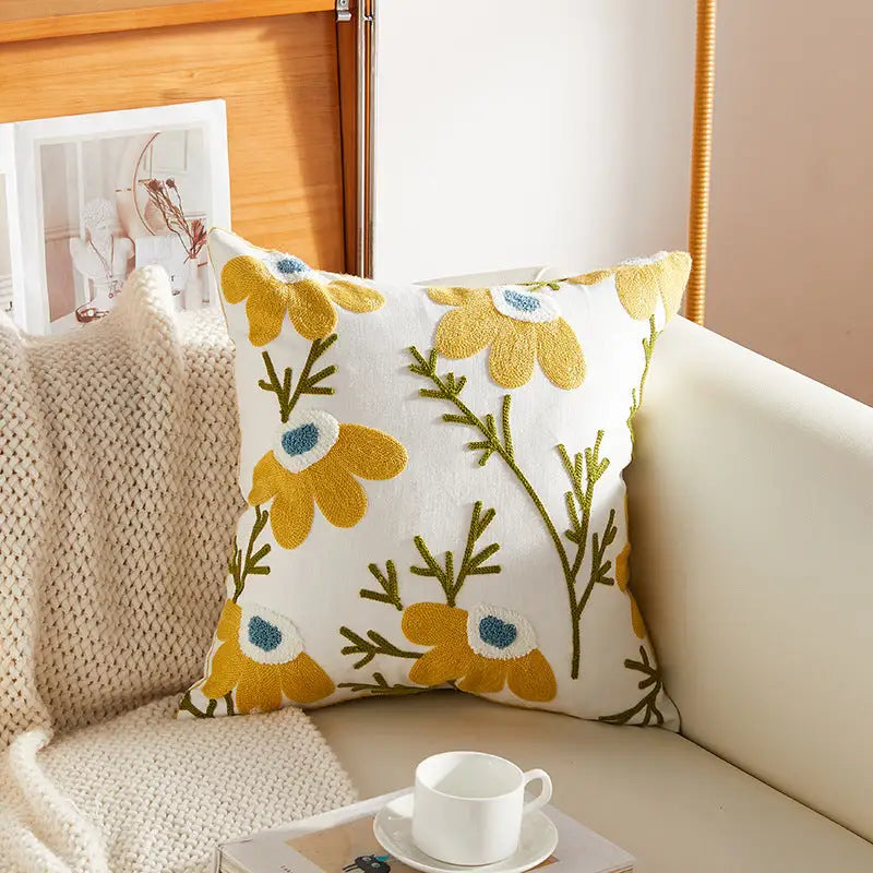 Floral embroidered throw pillow.