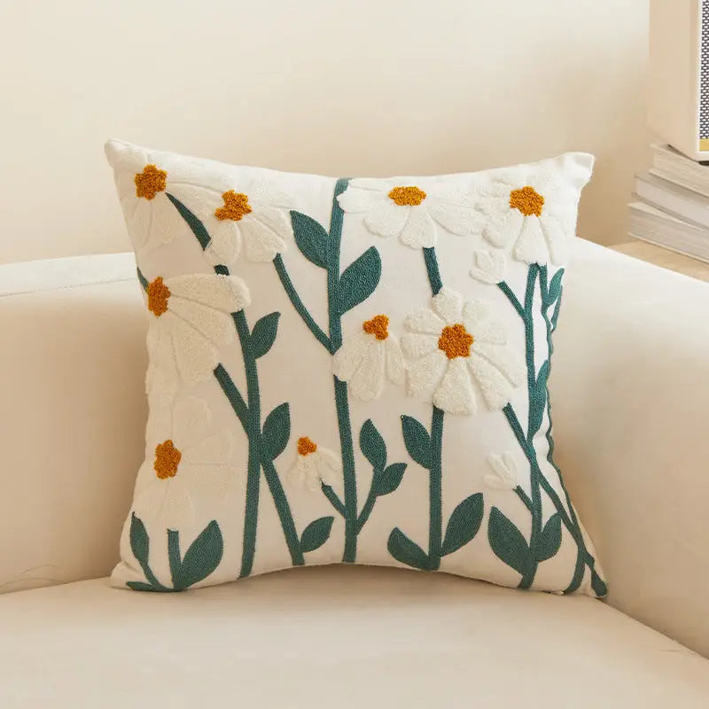 Floral embroidered throw pillow.