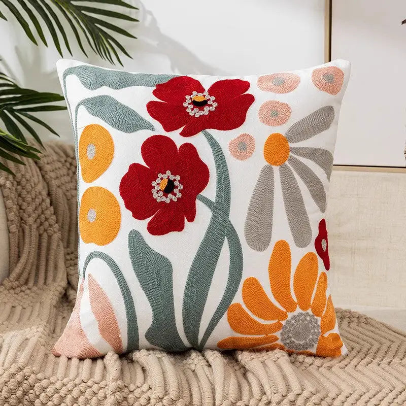 Floral embroidered throw pillow.