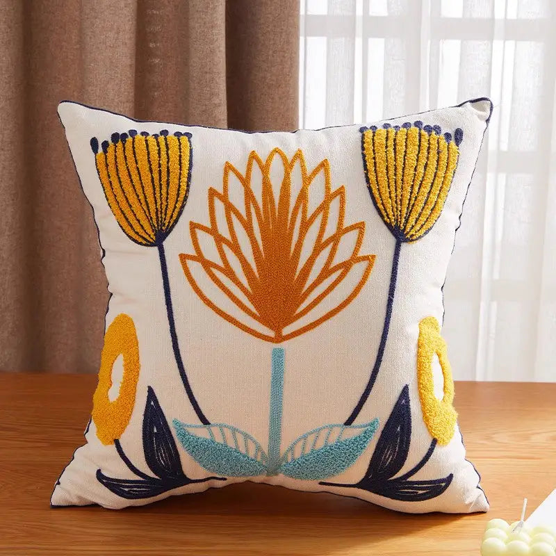 Embroidered floral throw pillow.