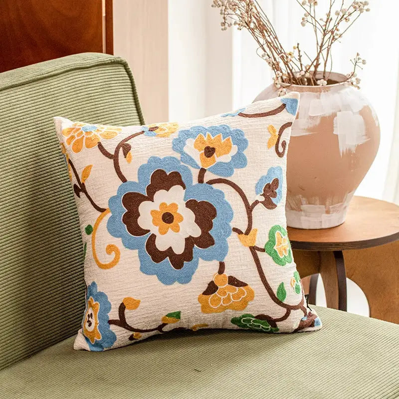 Floral embroidered throw pillow.