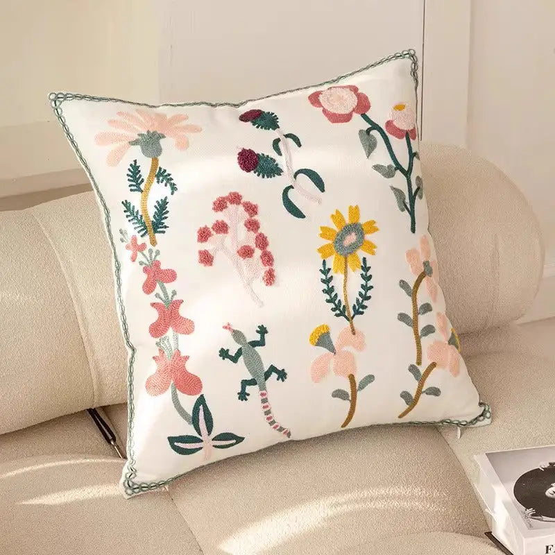 Embroidered floral throw pillow.