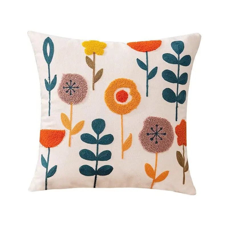 Floral embroidered throw pillow.