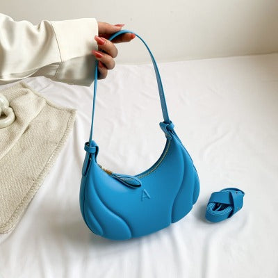 blue creasent shape bag