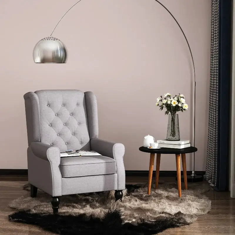 Gray tufted armchair.