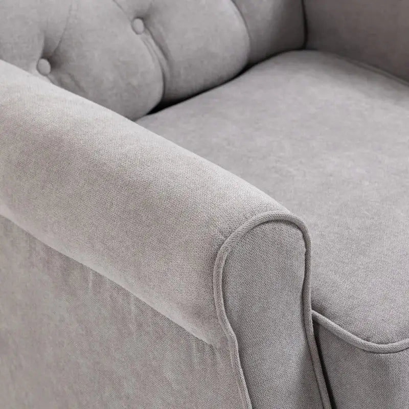Gray upholstered armchair.