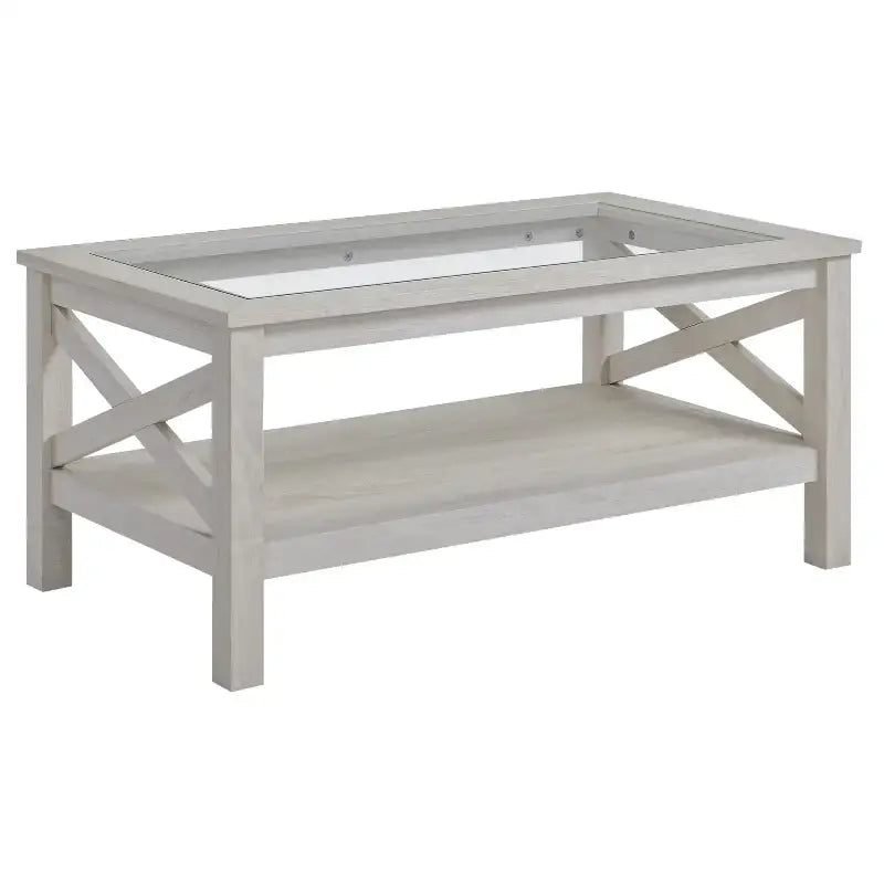 Farmhouse coffee table with light-colored wood, glass top, and lower shelf