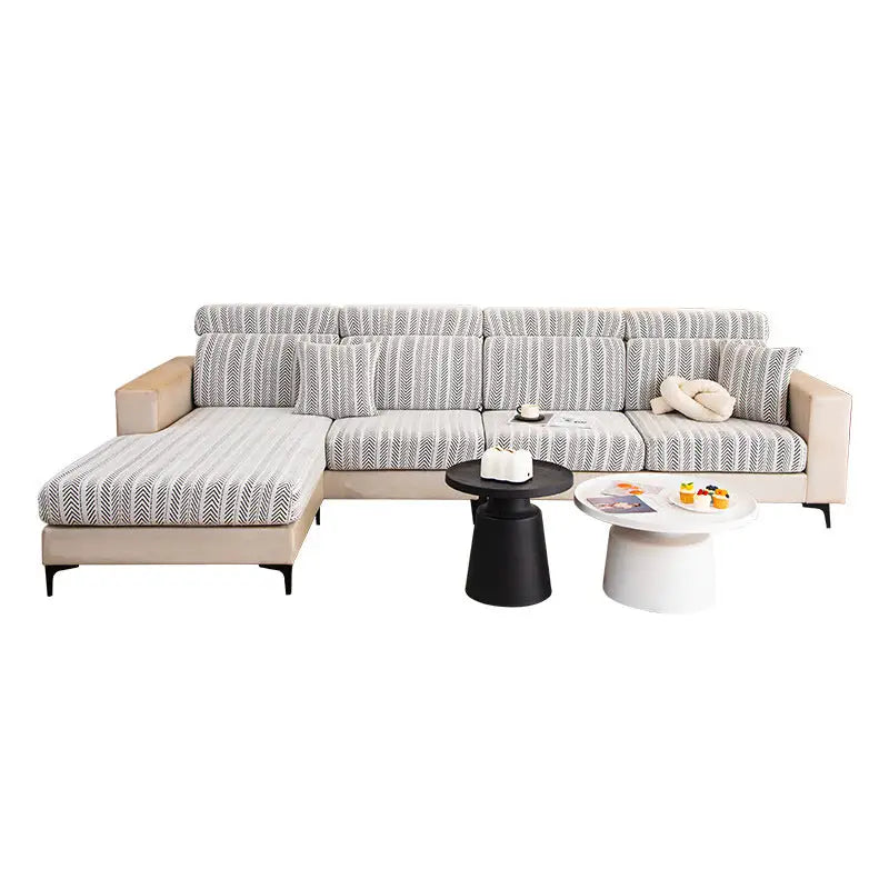 Beige sectional sofa with patterned cushions.