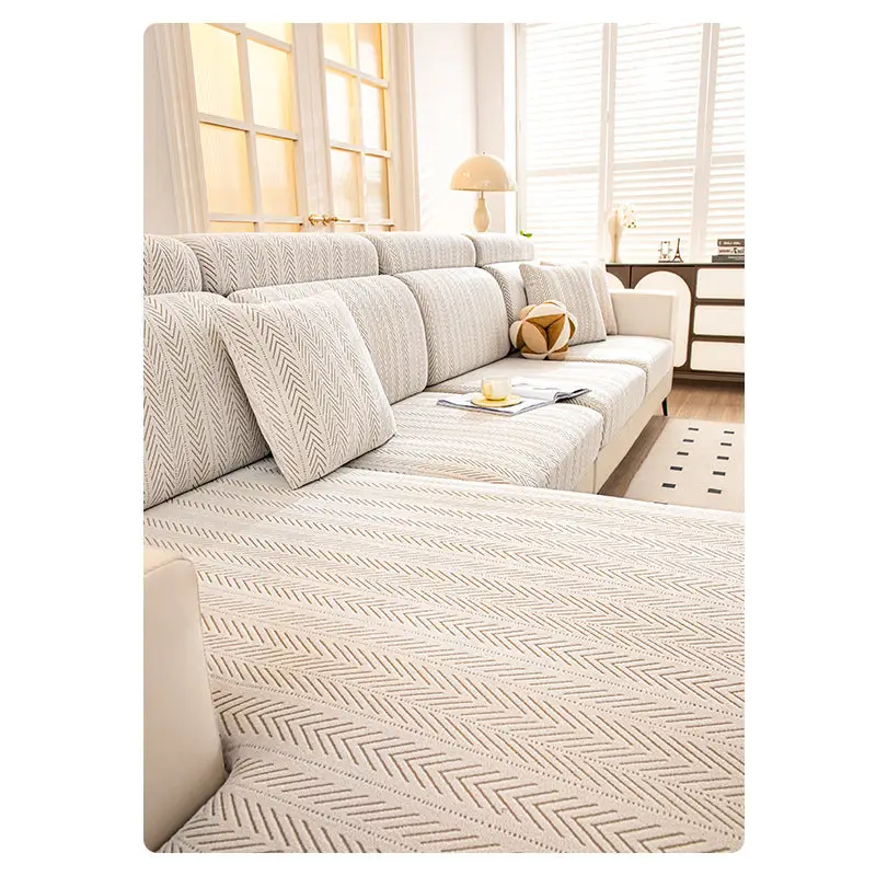 Beige sectional sofa with herringbone pattern.