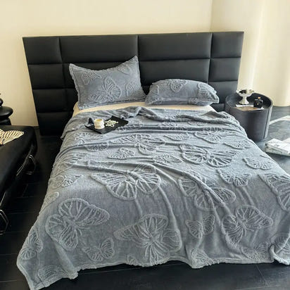 Butterfly-patterned gray bedding.