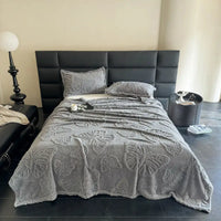 Gray butterfly-patterned bedspread.