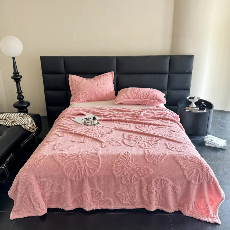 Pink butterfly-patterned bedspread.