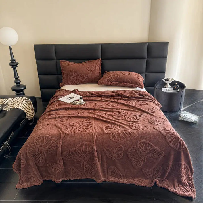 Brown butterfly-patterned bedspread.