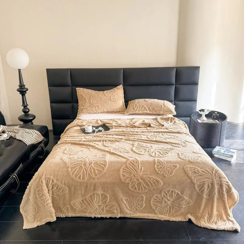 Butterfly-patterned bedspread.
