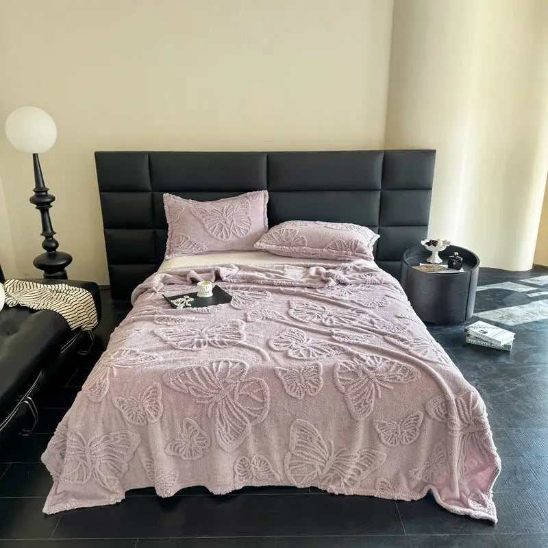 Butterfly-patterned bedspread.