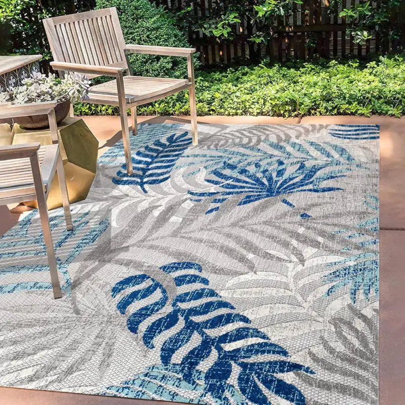 Tropical-patterned outdoor rug.