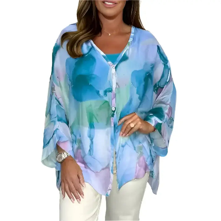 Blue and green watercolor-patterned blouse.