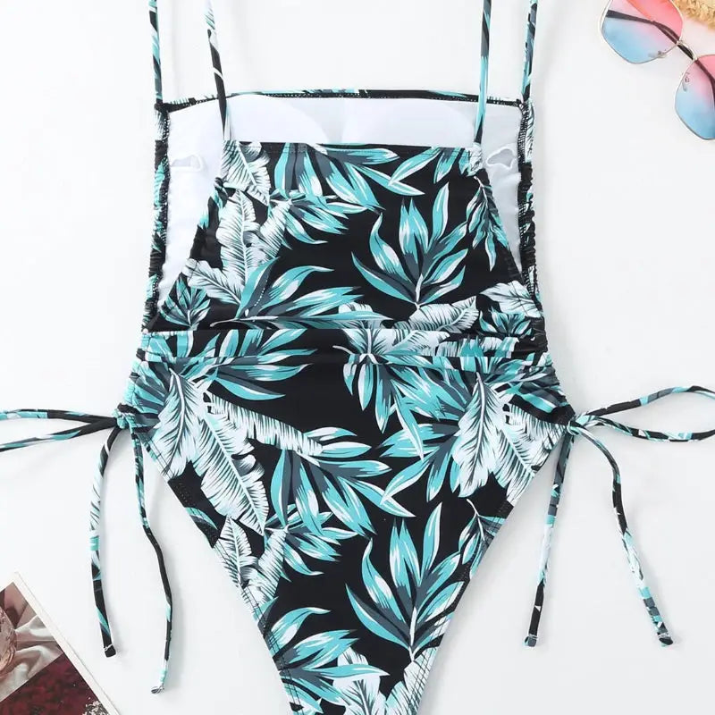 Leaf-patterned one-piece swimsuit.