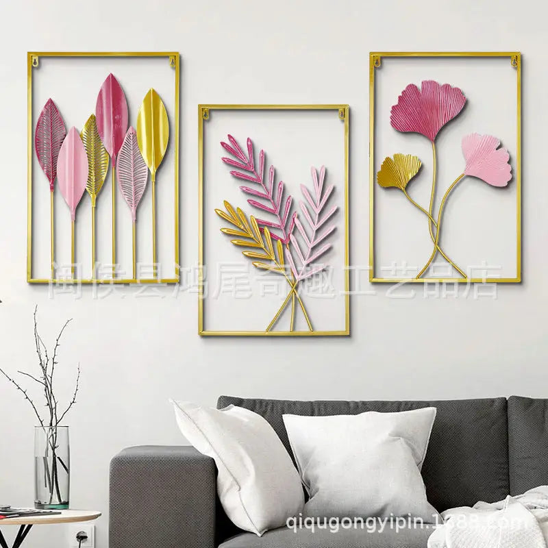 Three framed floral wall art pieces.