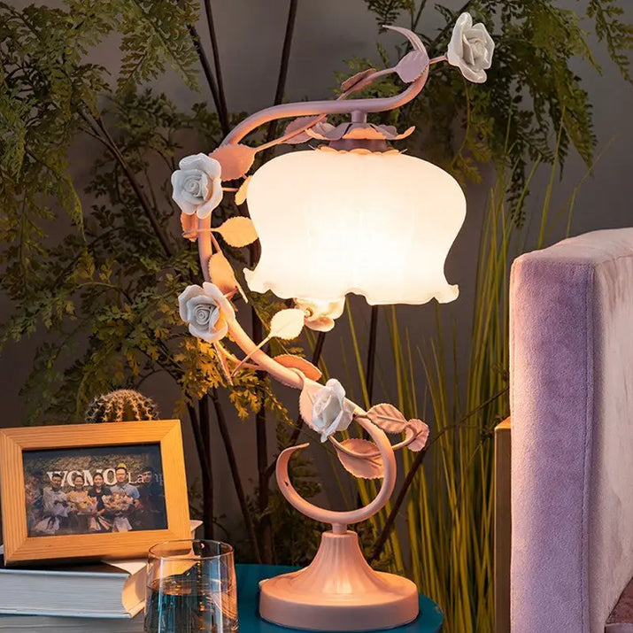 Pink rose-themed table lamp.