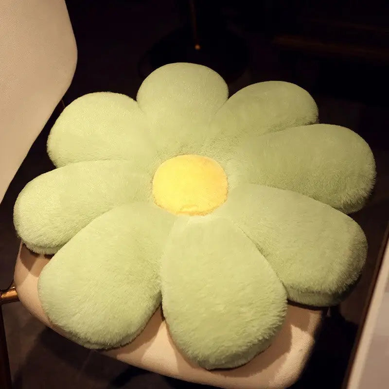Green flower-shaped plush cushion.