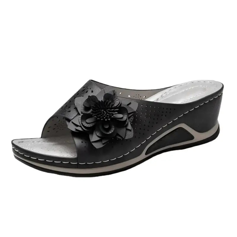 Black floral wedge sandal.