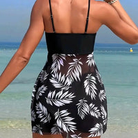 Black and white leaf-patterned swimsuit cover-up.